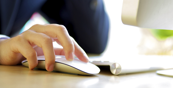 A person interacting with a computer via a mouse