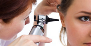 Patient getting an earwax exam