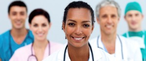 Attractive female Doctor standing before her team