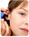 Little girl taking a hearing evaluation
